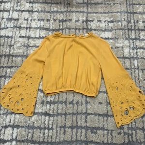 yellow flared sleeve top